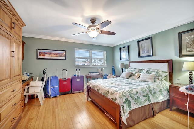 bedroom with light hardwood / wood-style floors, ceiling fan, and ornamental molding