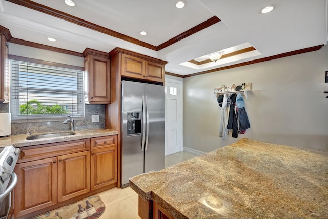 kitchen featuring backsplash, sink, crown molding, light tile patterned flooring, and stainless steel appliances