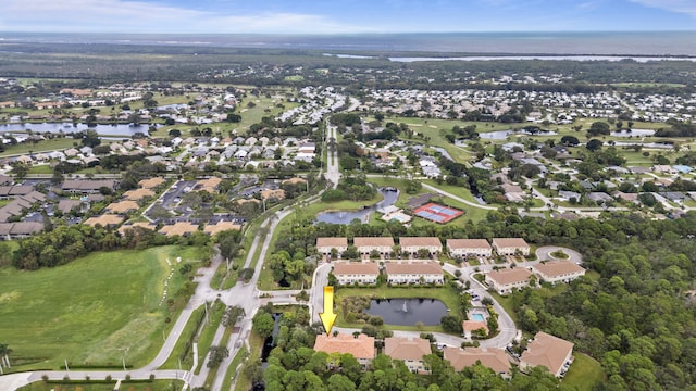aerial view with a water view and a residential view