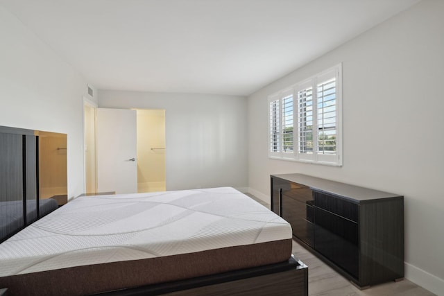 bedroom with light hardwood / wood-style flooring