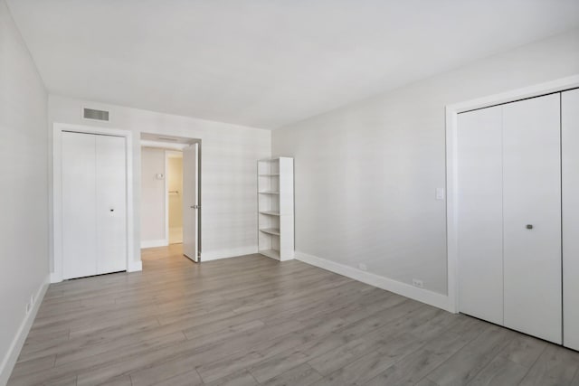 unfurnished bedroom with light hardwood / wood-style flooring