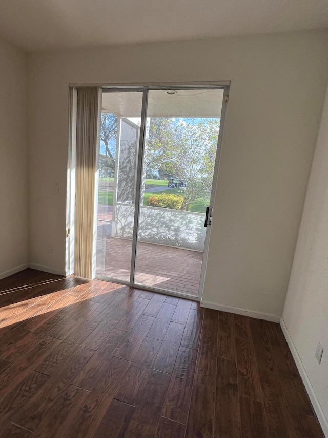 doorway featuring dark hardwood / wood-style floors