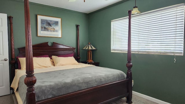 bedroom featuring ornamental molding and ceiling fan