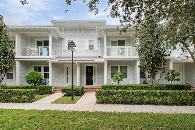 view of front of home with a balcony and a porch