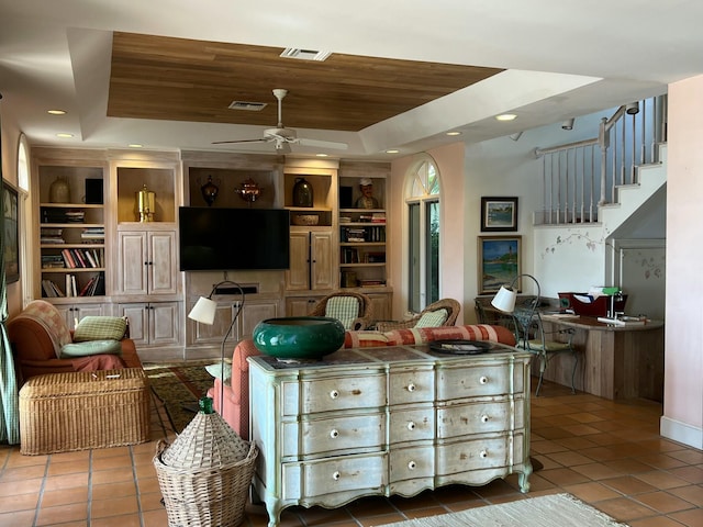 kitchen with wood ceiling, ceiling fan, a raised ceiling, tile patterned flooring, and built in features