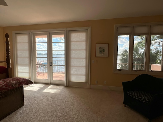 doorway with light colored carpet and french doors