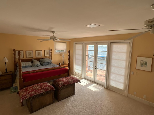 bedroom featuring french doors, ceiling fan, carpet floors, and access to outside