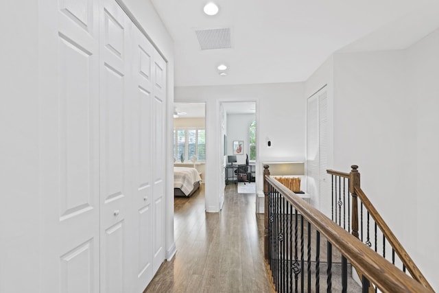 corridor featuring dark wood-type flooring