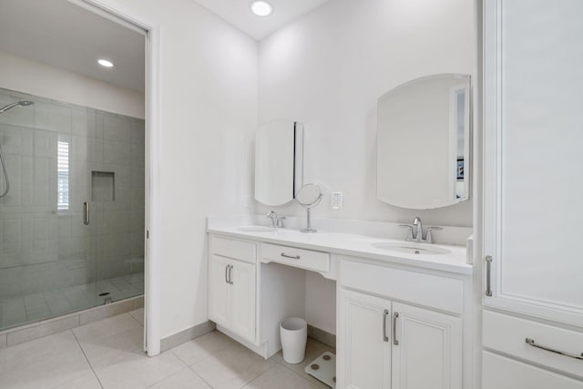 bathroom with vanity, walk in shower, and tile patterned flooring