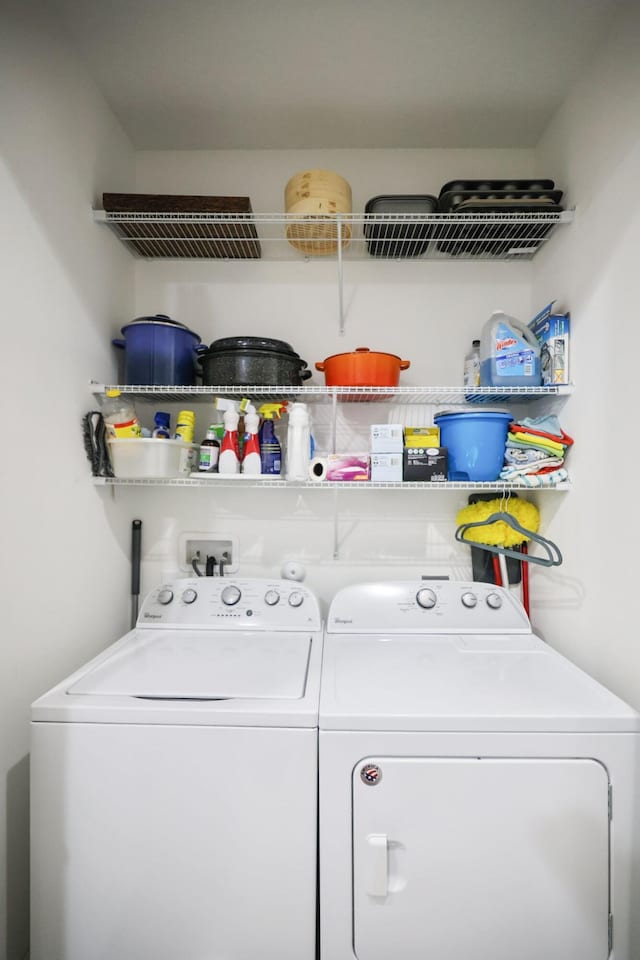 clothes washing area with washer and dryer