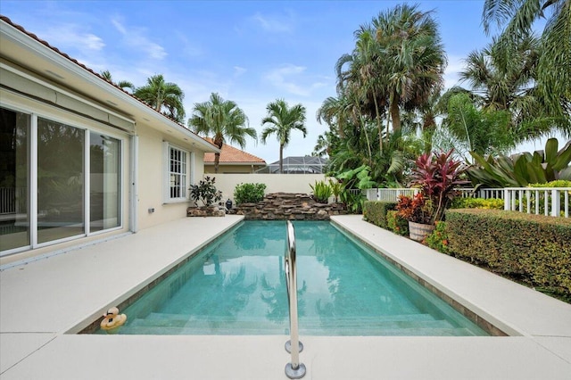 view of swimming pool with a fenced in pool and a fenced backyard