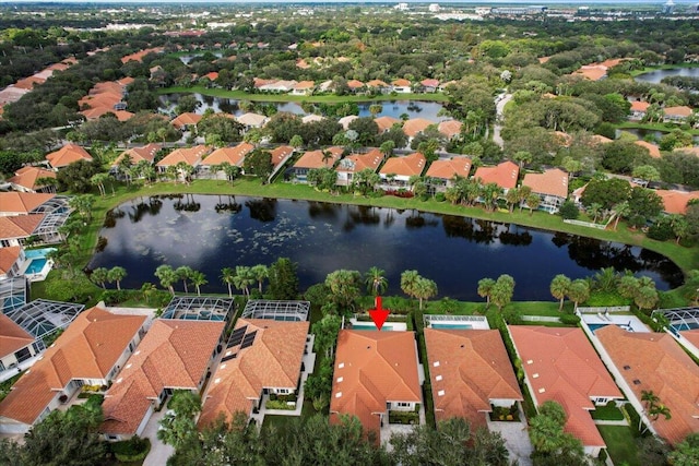 drone / aerial view with a water view and a residential view