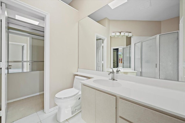 full bathroom featuring tile patterned flooring, vanity, toilet, baseboards, and a shower stall