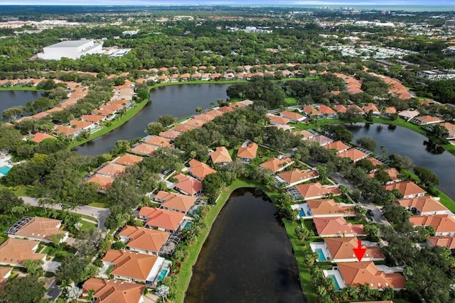 birds eye view of property featuring a water view and a residential view