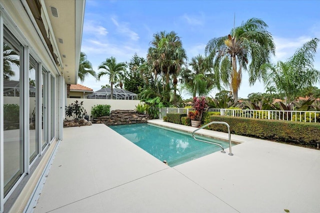 view of pool with a fenced backyard, a fenced in pool, and a patio area