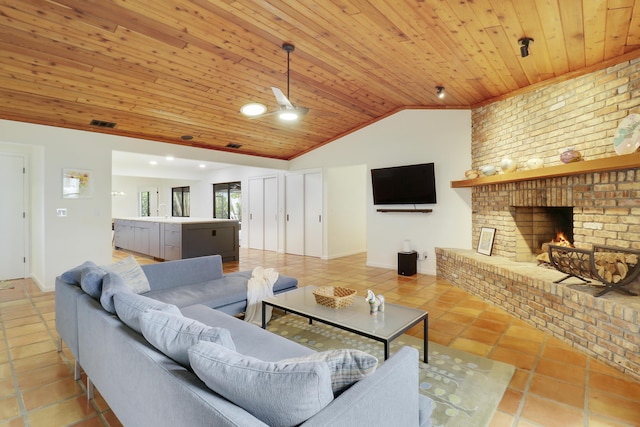 tiled living room featuring ceiling fan, wood ceiling, vaulted ceiling, and a fireplace