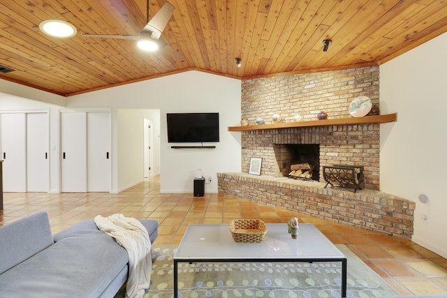 living room with lofted ceiling, a fireplace, light tile patterned floors, and wood ceiling