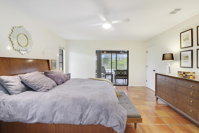 tiled bedroom with ceiling fan and access to outside