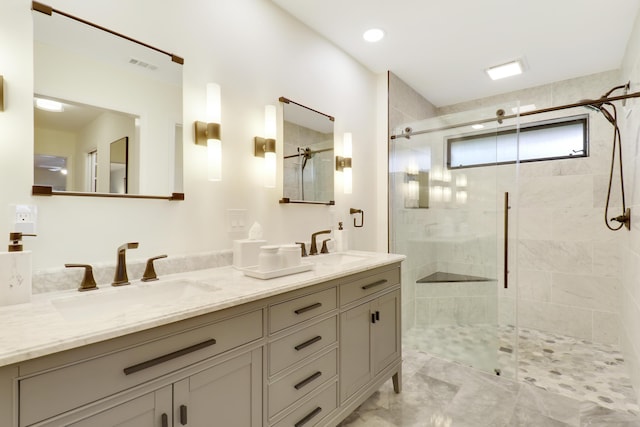 bathroom featuring an enclosed shower and vanity