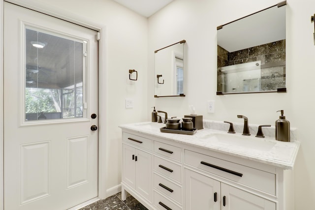 bathroom with walk in shower and vanity