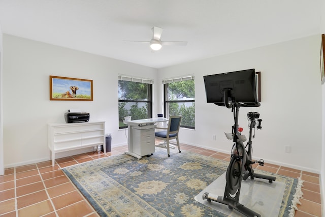 interior space with ceiling fan and tile patterned floors