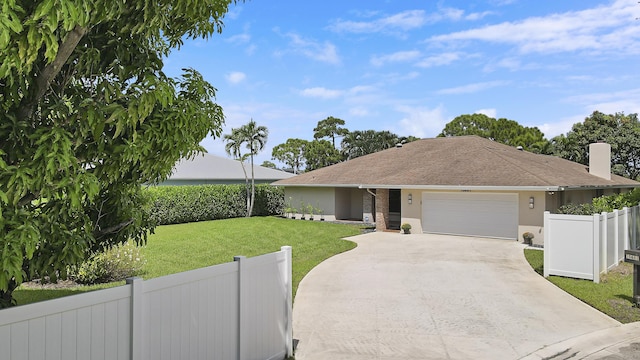 ranch-style home with a front yard and a garage