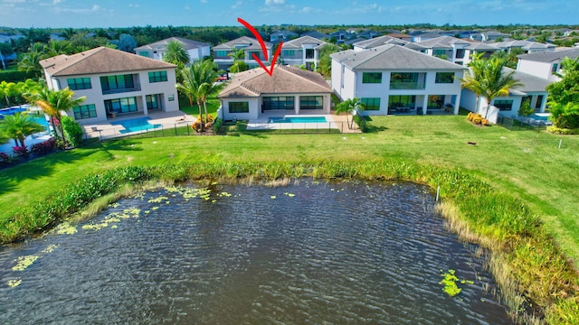 birds eye view of property with a water view