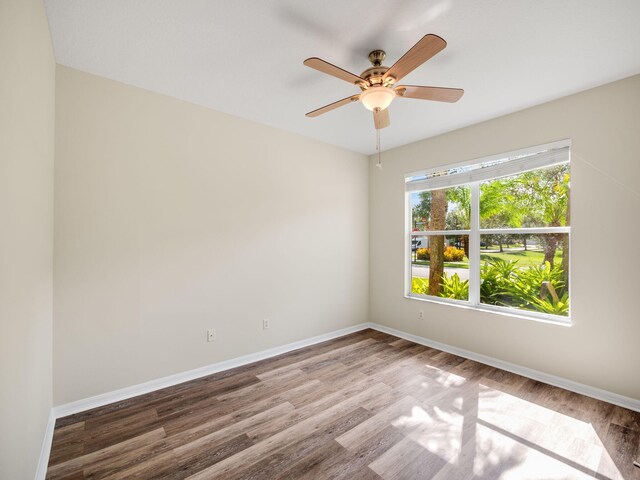 unfurnished room featuring hardwood / wood-style floors and ceiling fan