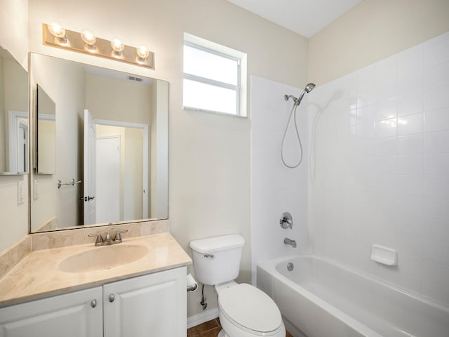 full bathroom with vanity, toilet, and tiled shower / bath combo