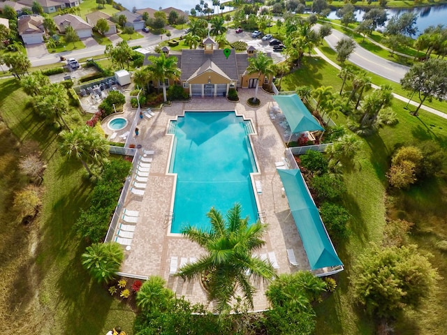 birds eye view of property with a water view