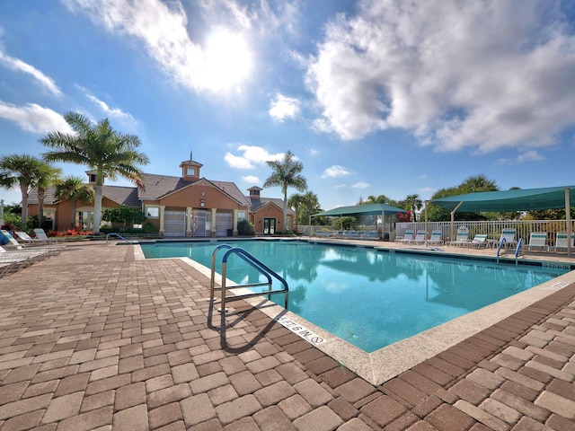 view of swimming pool featuring a patio area