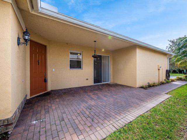 doorway to property featuring a patio area