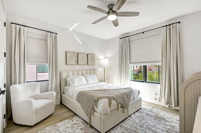 bedroom featuring ceiling fan and light wood-type flooring