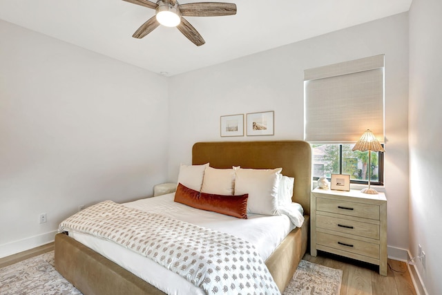 bedroom featuring light wood-type flooring and ceiling fan