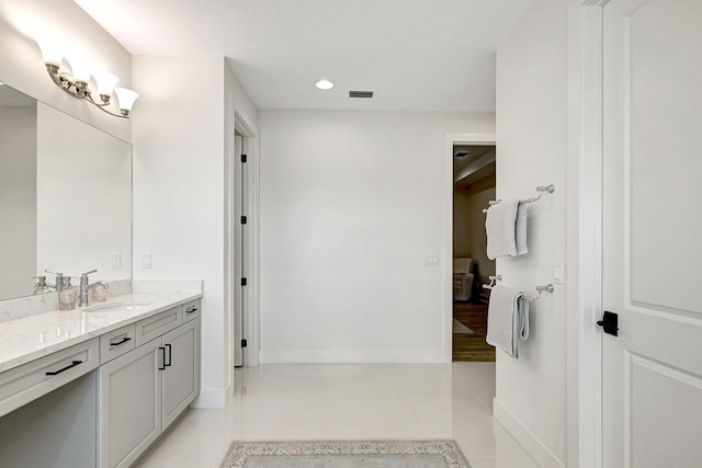 bathroom with tile patterned floors and vanity