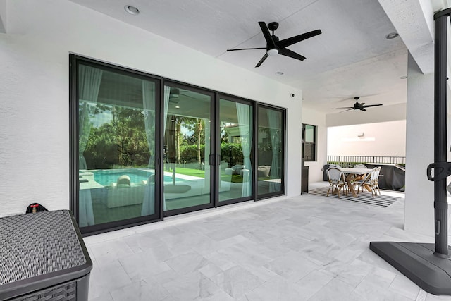 entryway with a textured ceiling and ceiling fan