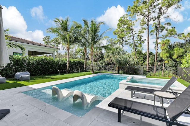 view of swimming pool featuring a patio area and a yard