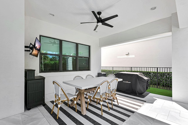 view of patio with area for grilling and ceiling fan