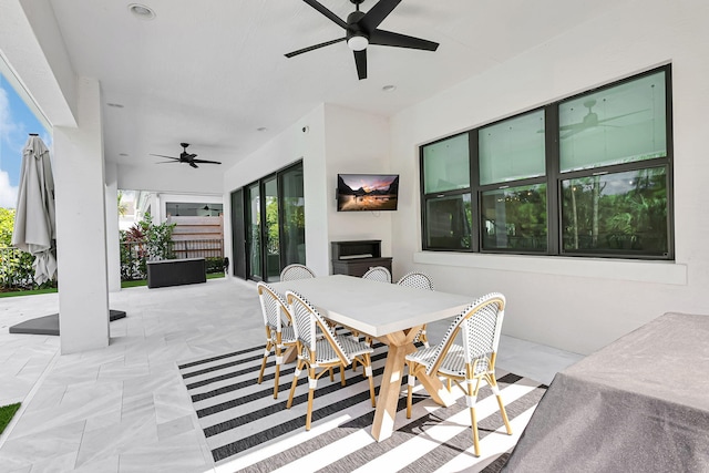 view of patio featuring ceiling fan