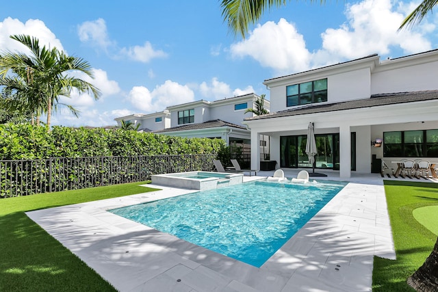 view of pool featuring an in ground hot tub and a patio