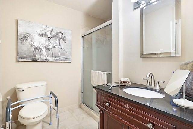 bathroom featuring vanity, a shower with shower door, and toilet