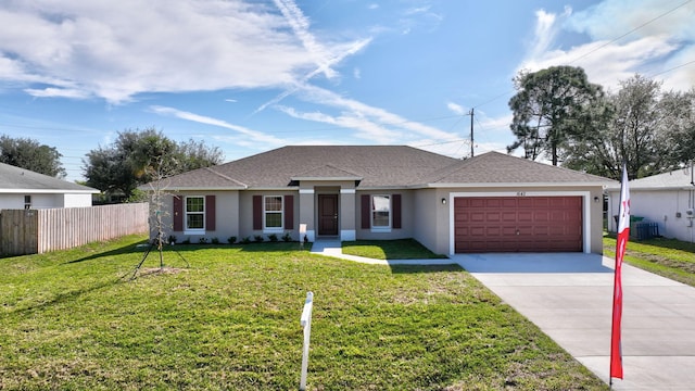 ranch-style house featuring a garage and a front yard