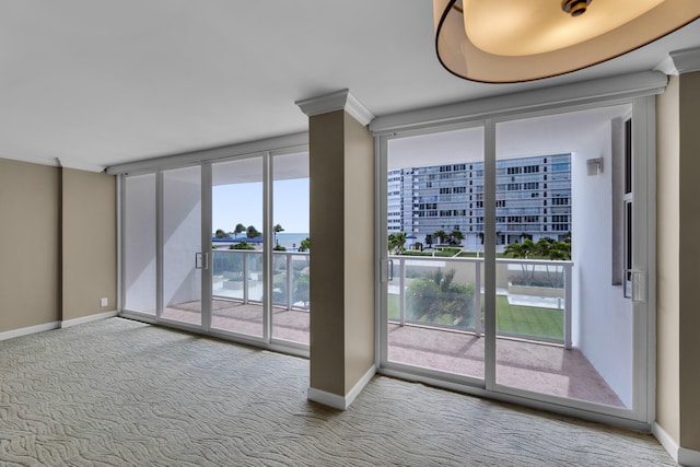 interior space featuring ornamental molding and carpet floors