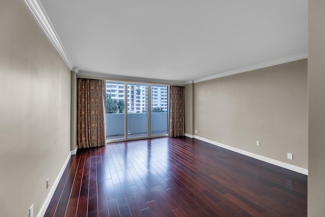 empty room with dark wood-type flooring, a wall of windows, and crown molding