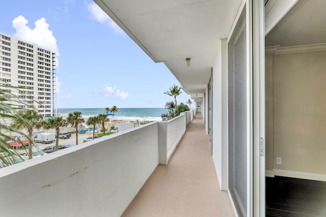 balcony with a view of the beach and a water view