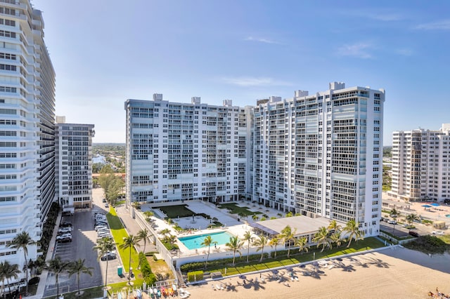 view of building exterior featuring a community pool