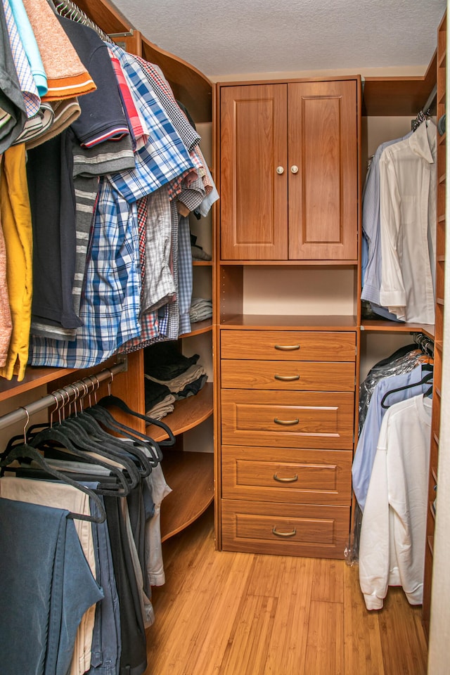 spacious closet featuring light wood-type flooring