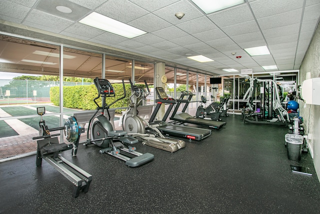 workout area featuring a paneled ceiling