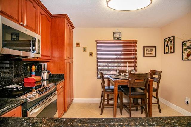 dining room featuring a textured ceiling