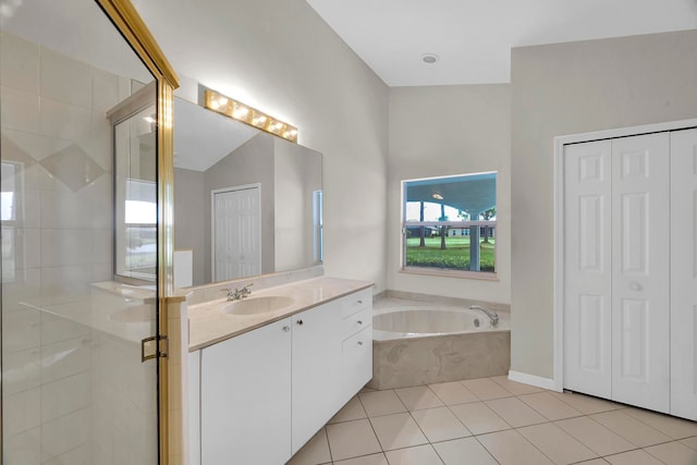 bathroom featuring vanity, tile patterned floors, and separate shower and tub